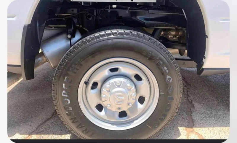 Detailed pickup wheel and wheel well presented by Smiley's Auto Detailing